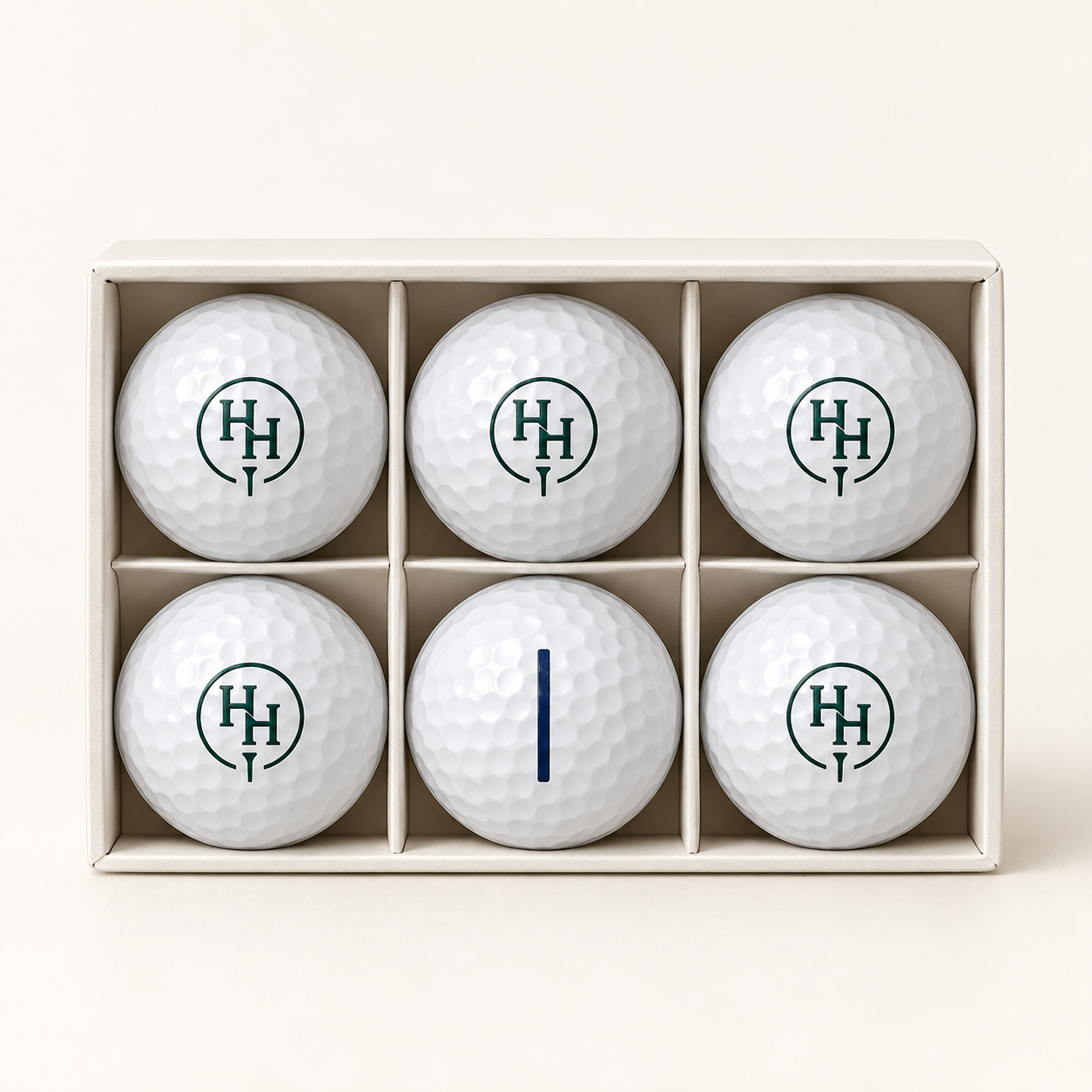 Concept white HH golf balls with green monogram